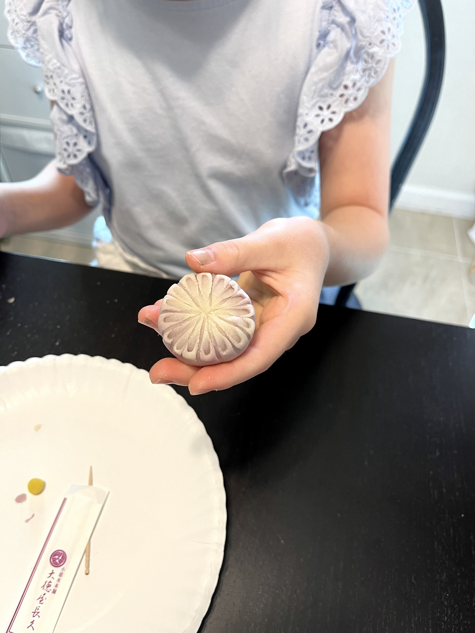Child focused on wagashi making